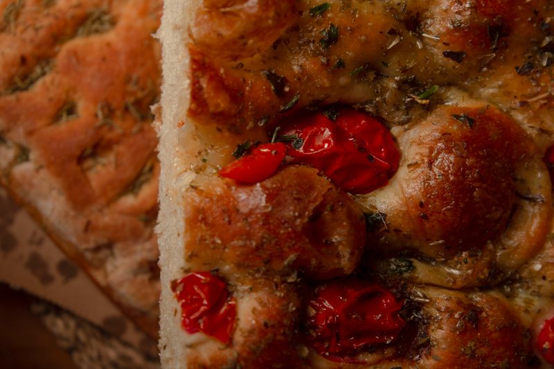 Fresh-baked focaccia bread with herb dipping oil